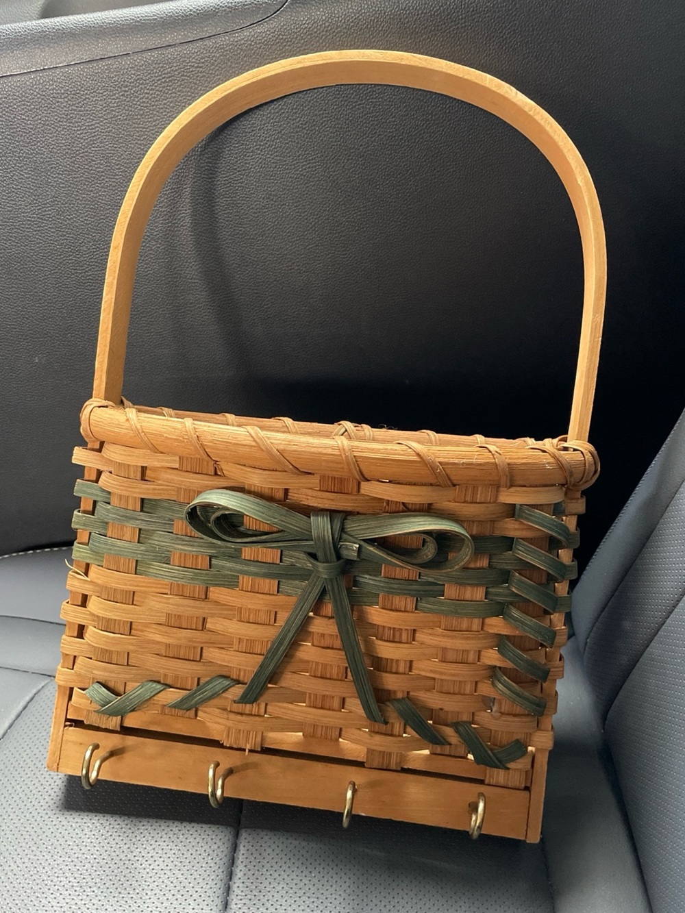 Woven Basket Wall Pocket Mail Holder With Key Hooks. Green bow accent.